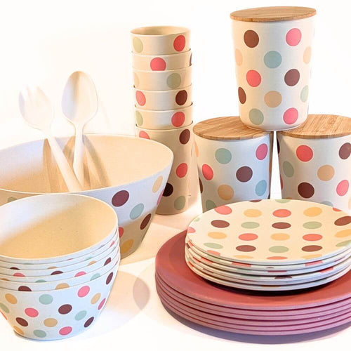 Bamboo Tableware - A value packed bundle of plates cups, bowls, salad bowl and canisters.  All piled up.  The colour combination is the Polka Dot pattern (think Retro Style) and Raspberry.  It's a fun and happy colour combination