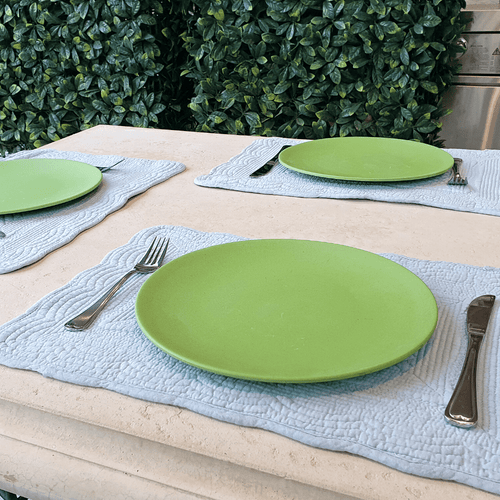 Bamboo Dinner Plate on an outdoor table