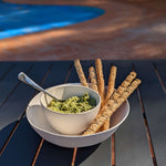 Bamboo serving bowl with dip and small bamboo rice bowl