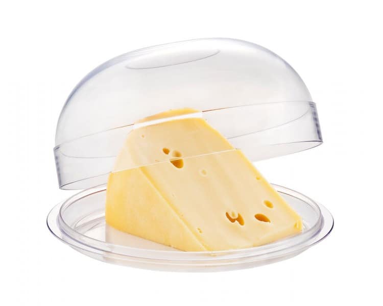 Salad bowl with lid ajar, cheese board